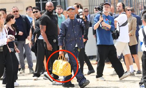 warning his fellow imbibers when they touch his louis vuitton bag,|(Solved) .